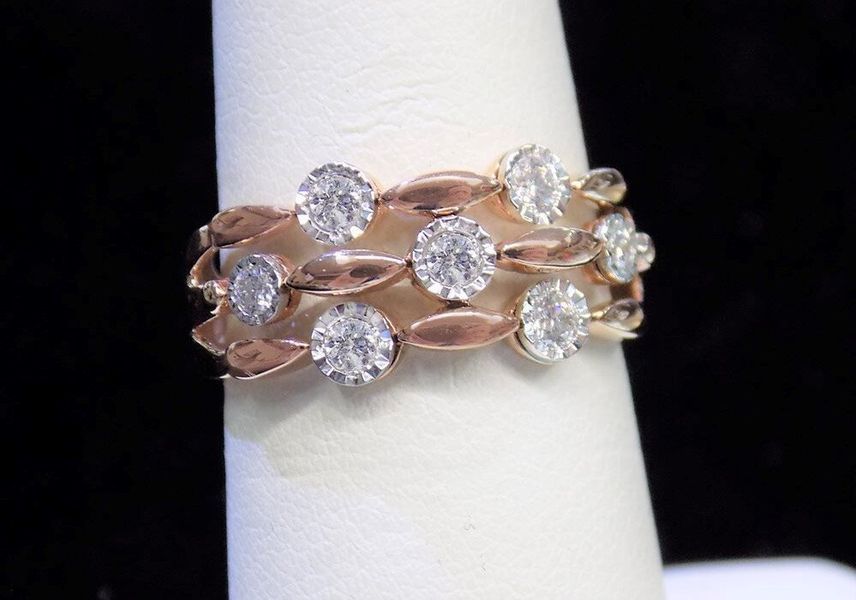 Rose gold ring with three rows of diamonds and leaf-shaped accents