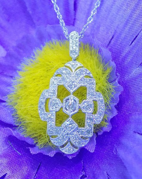 Silver diamond pendant on a delicate chain,