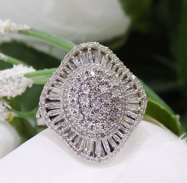 Diamond ring with a cluster of round and baguette-cut stones set