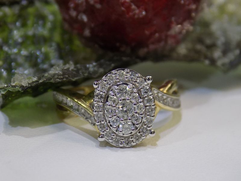 Oval diamond ring with a halo setting