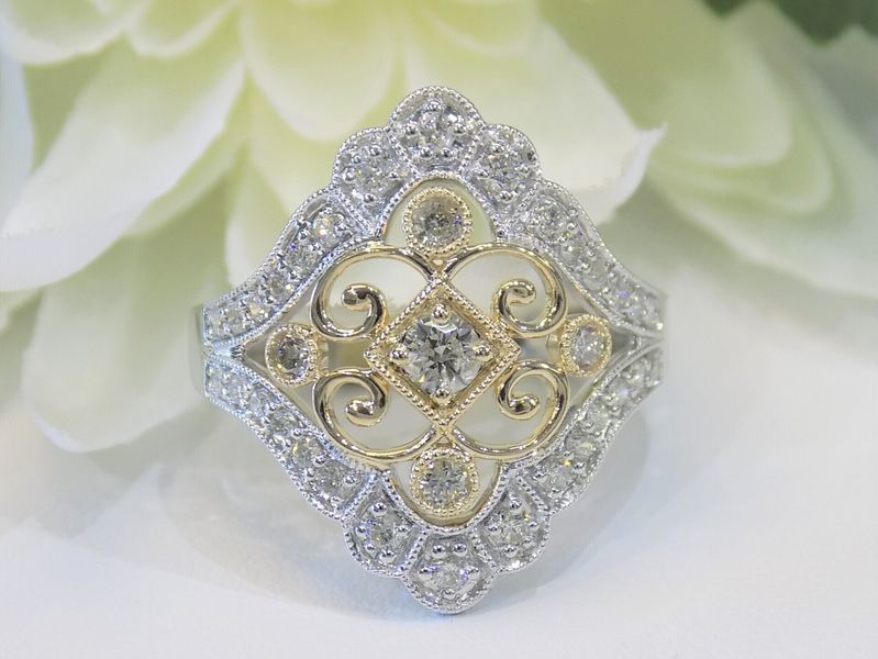 Diamond ring with white gold and yellow gold accents