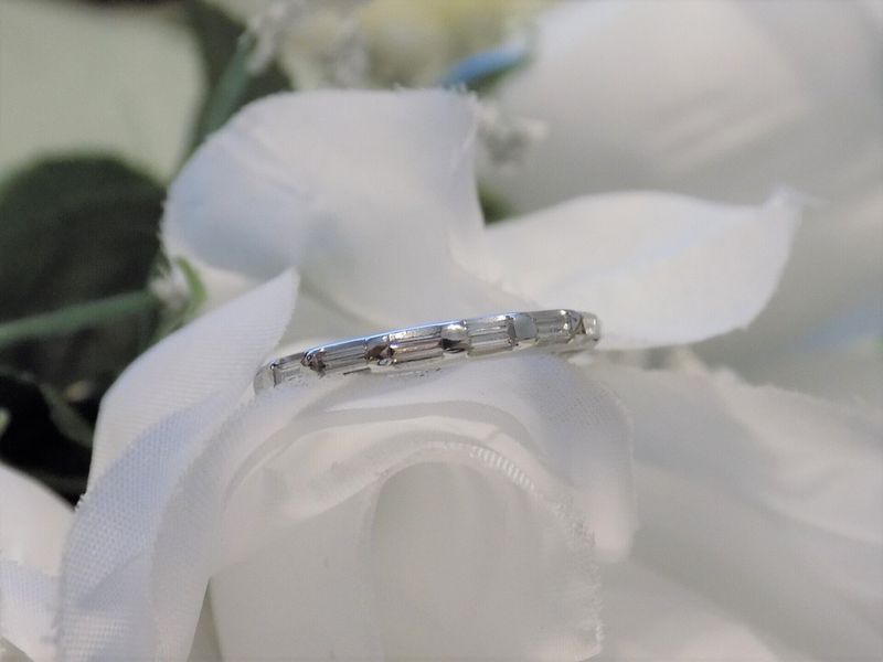 Wedding ring on a white flower