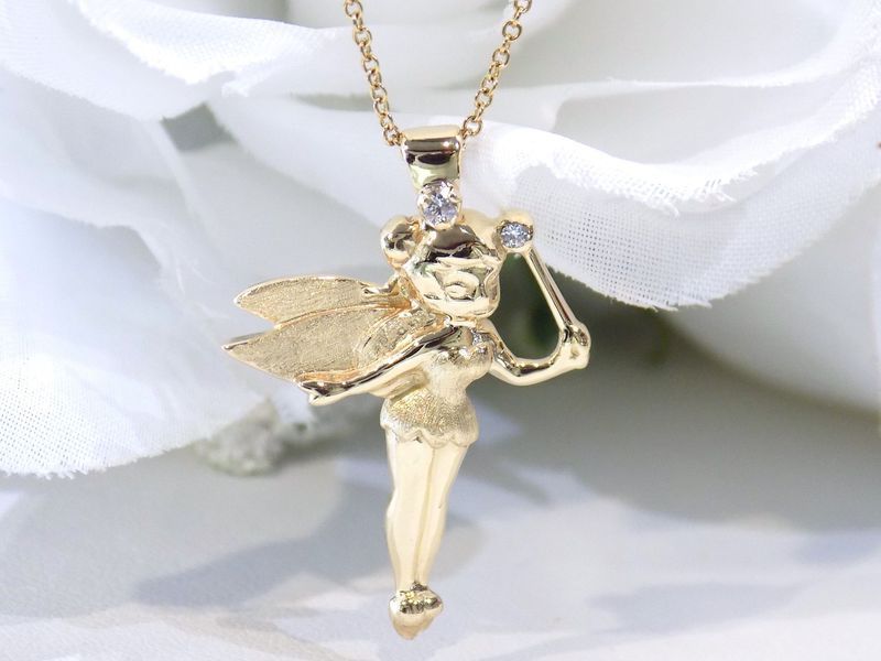 Gold fairy pendant necklace with diamonds