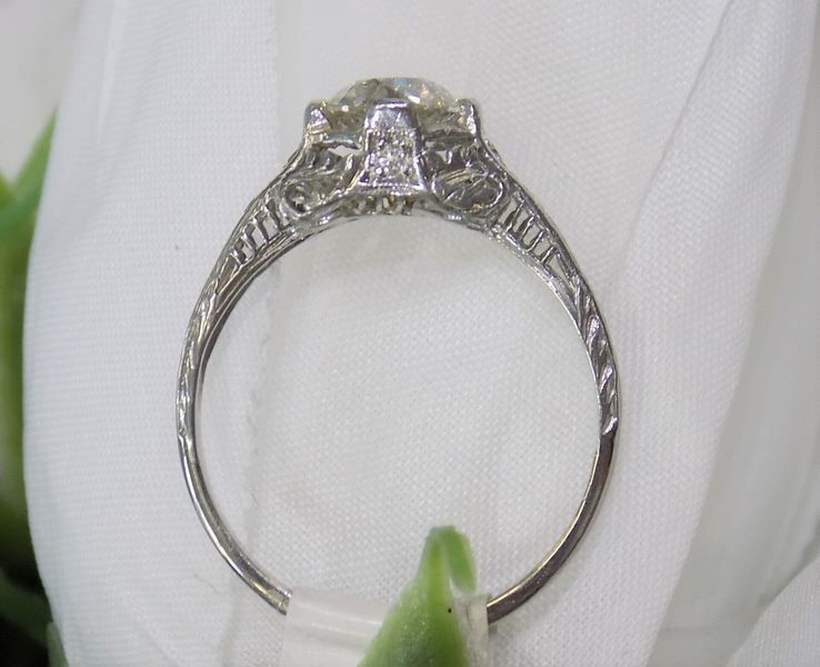 Diamond engagement ring with filigree detailing