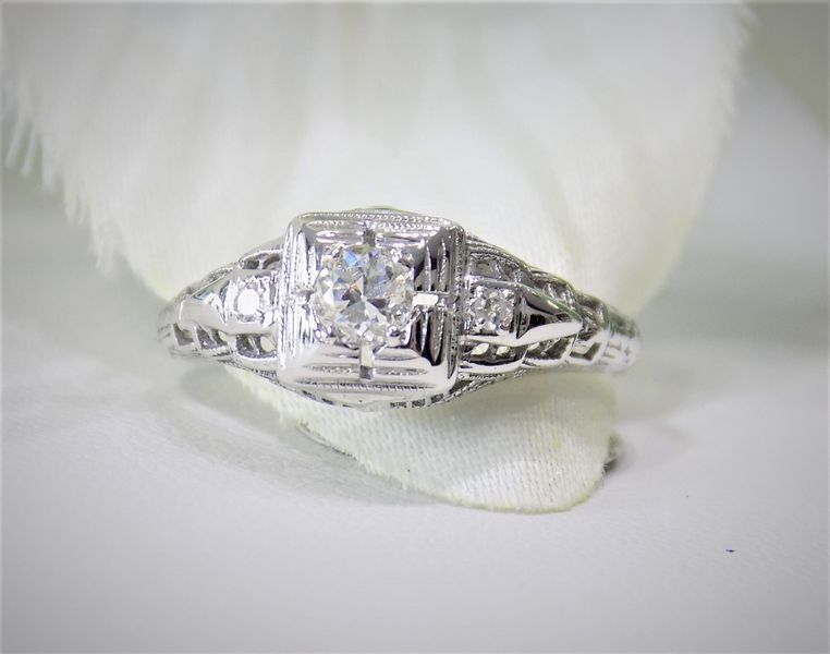 Diamond ring with a square center stone