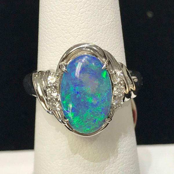 White gold ring with oval opal and diamond accents