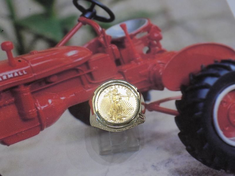 Gold coin ring in focus