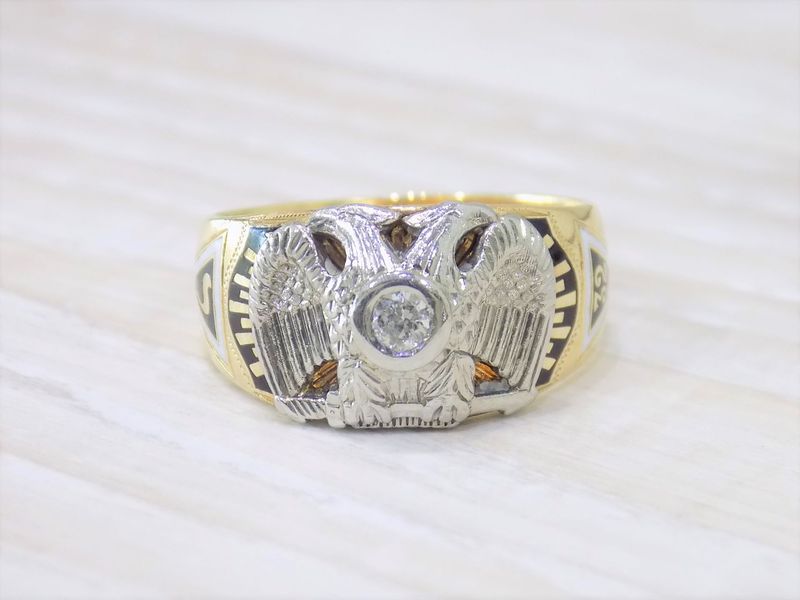Gold ring with a diamond and two-headed eagle emblem