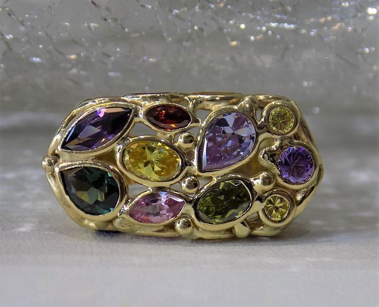 Gold ring with colorful gemstones in a cluster design