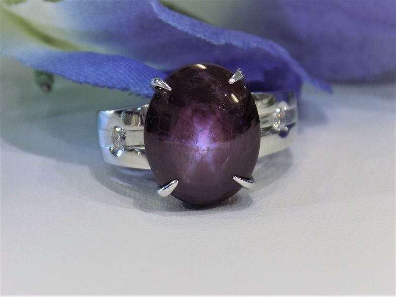 A purple star sapphire ring set in silver