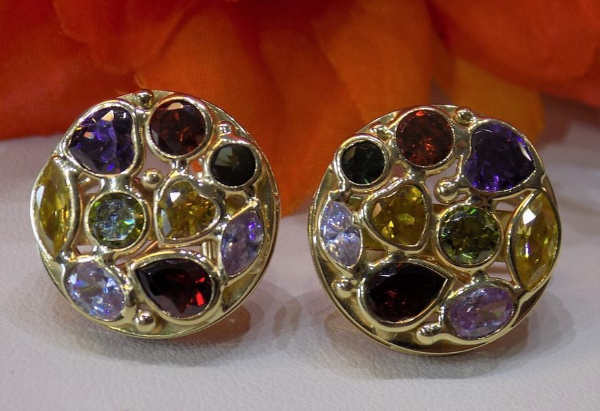 Gold stud earrings with colorful gemstones arranged
