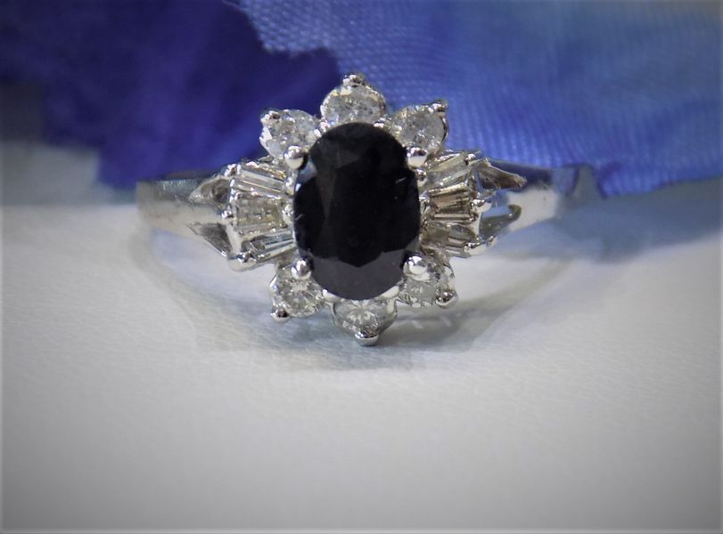 Ring with a large oval black stone 