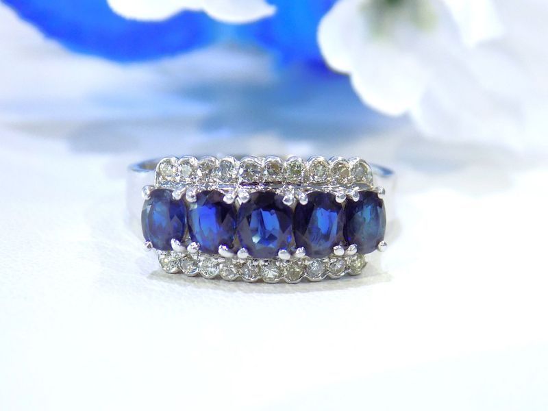 Sapphire and diamond ring set in white metal