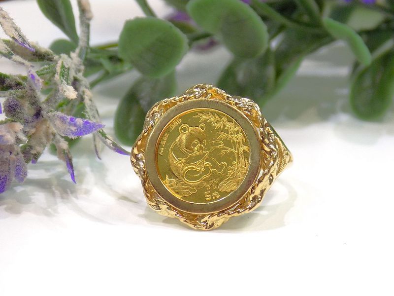 Gold ring featuring a panda gold coin