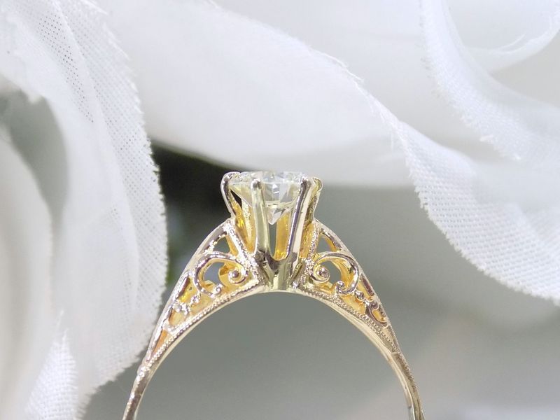 Gold engagement ring with a diamond
