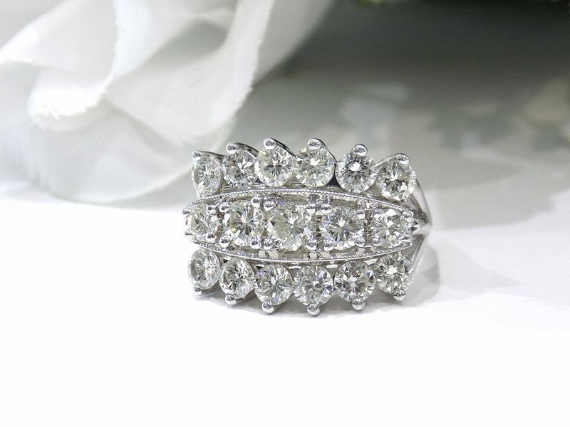 Diamond ring with three rows of round-cut stones