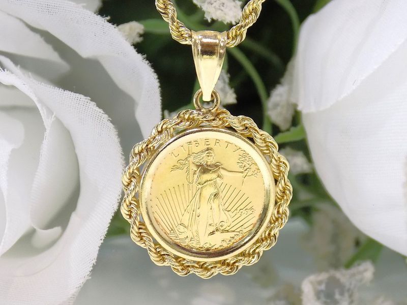 Gold pendant with a coin design