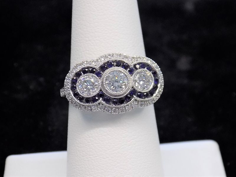 Diamond ring with three center stones
