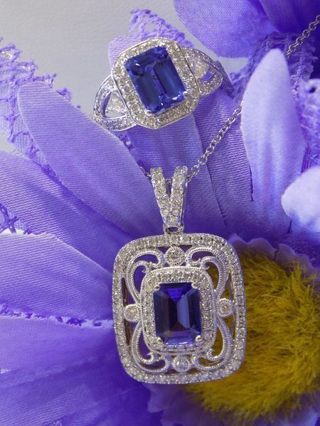 Ring and pendant with blue gems on a purple flower