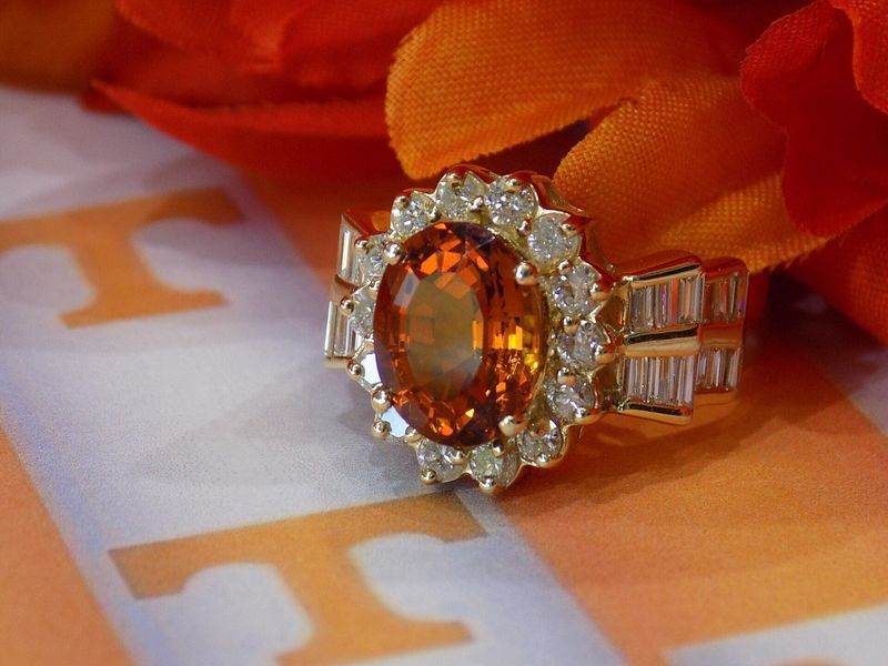 Orange and gold gemstone ring with diamond