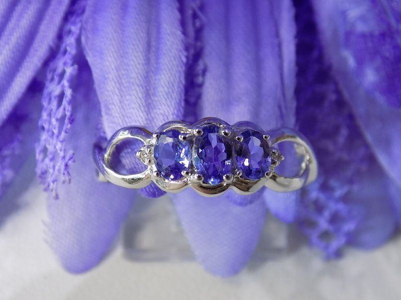 Silver ring with three oval blue gemstones