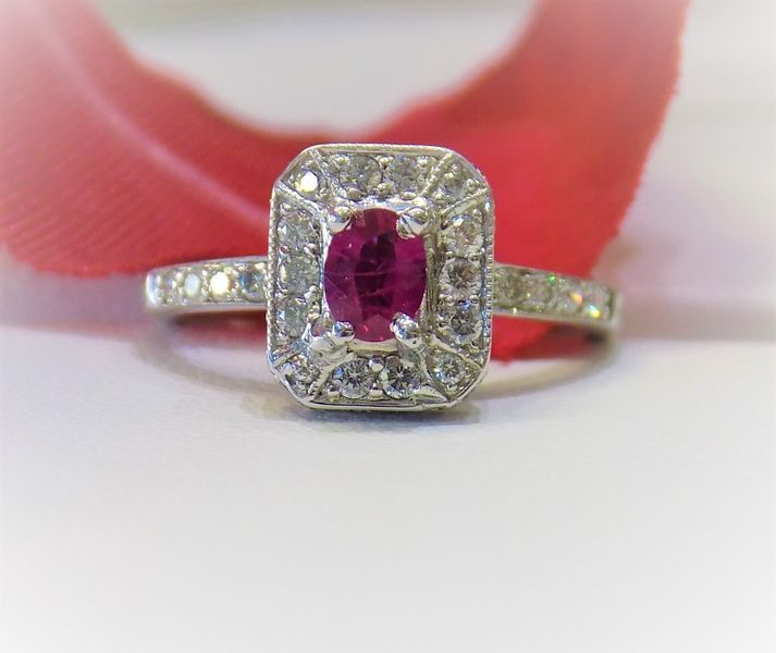 Ruby and diamond ring, white gold setting, red ruby center stone