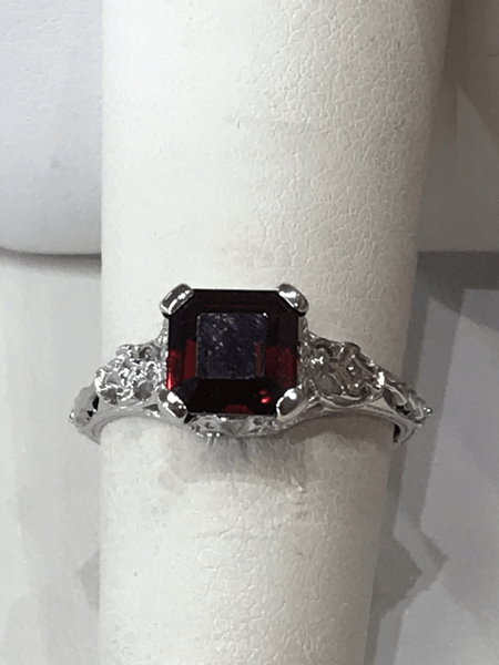 Silver ring with a square