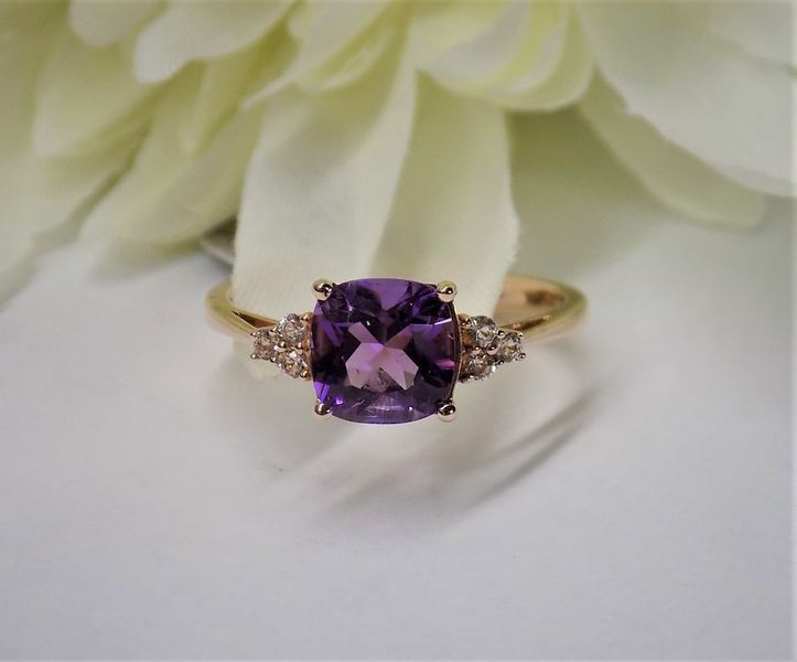 Gold ring with a square purple amethyst and small diamond accents