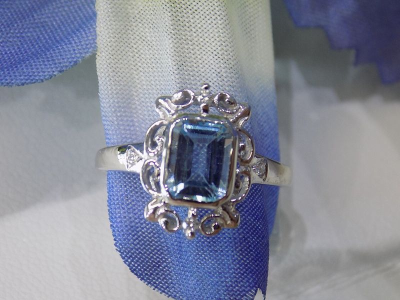 Silver ring with a rectangular blue gemstone