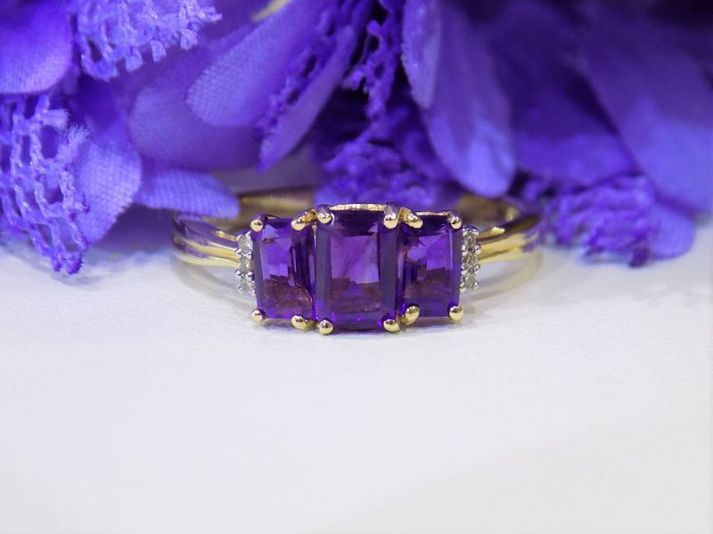 Amethyst ring with three emerald-cut stones