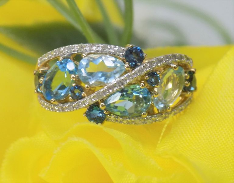 Jeweled gold ring with blue, green, and yellow gemstones