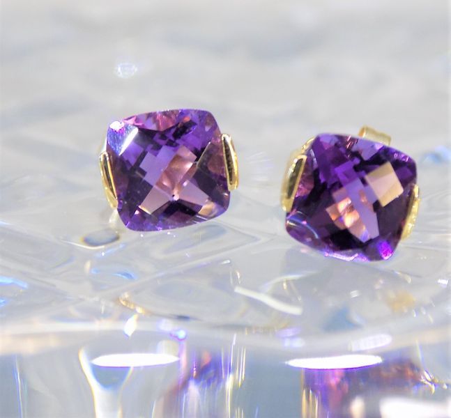 Purple amethyst stud earrings with gold settings