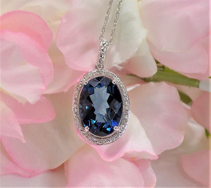 Necklace with large blue gemstone pendant