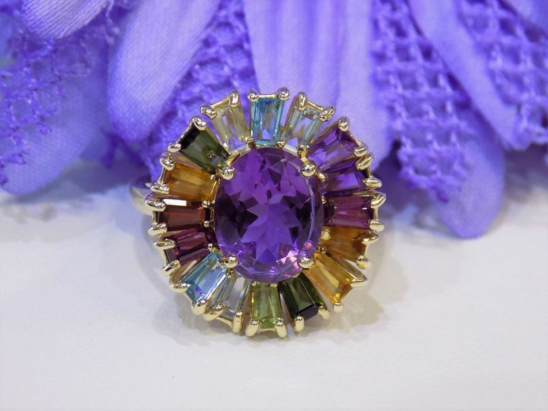 Gold ring with a large oval amethyst 