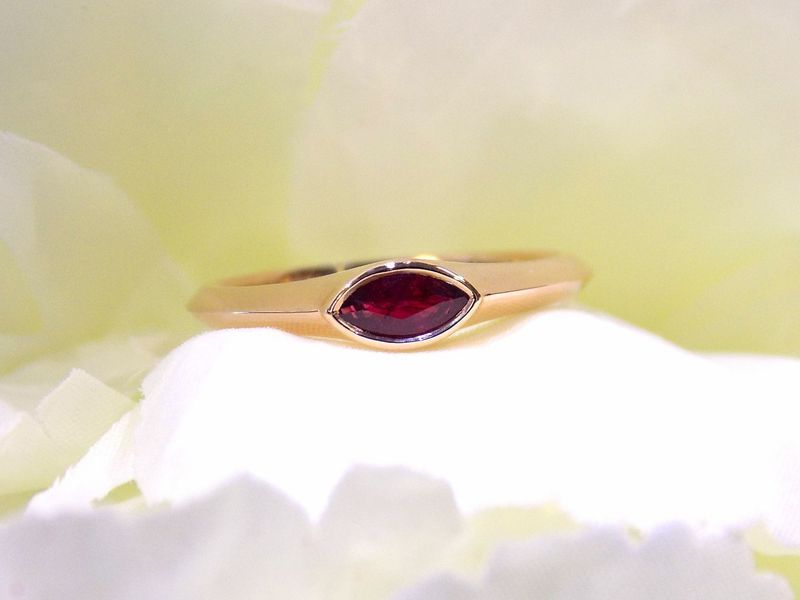 Gold ring with a marquise-cut