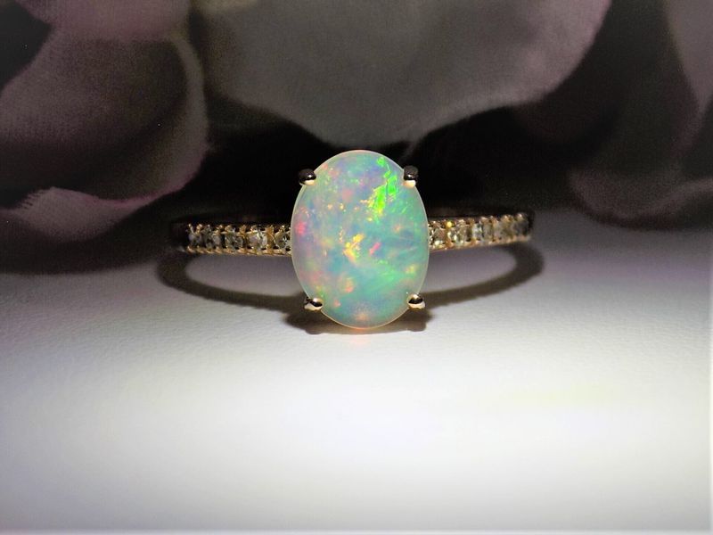 Oval opal ring with a gold band