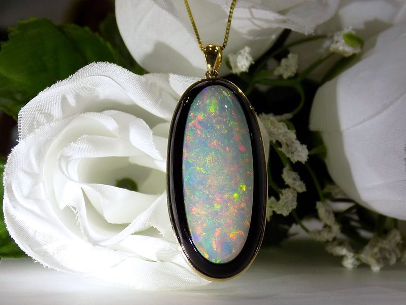 Oval opal pendant necklace with colorful play-of-color