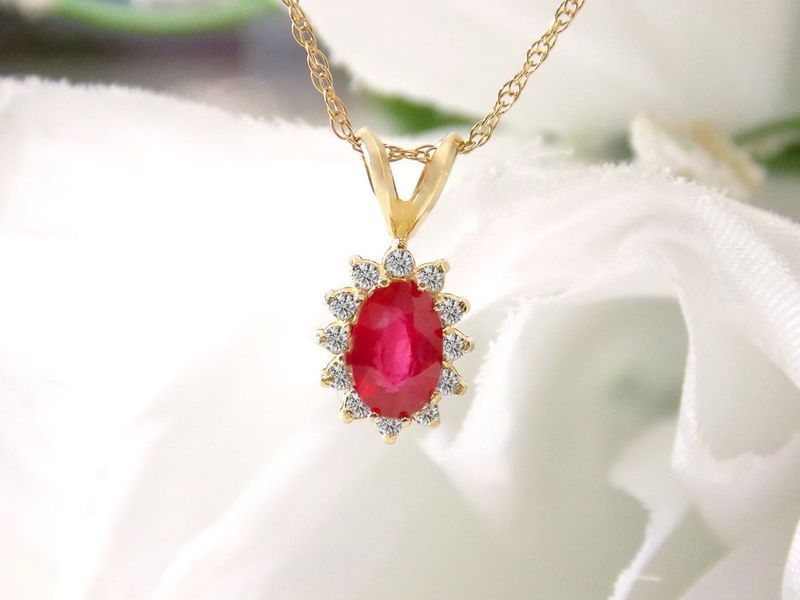 Gold necklace with a ruby and diamond pendant