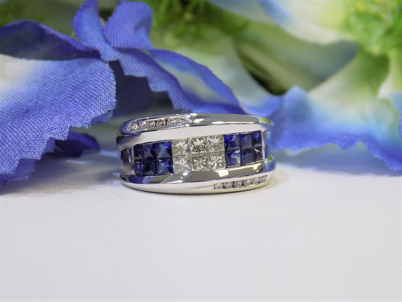 Diamond and sapphire ring on a white surface