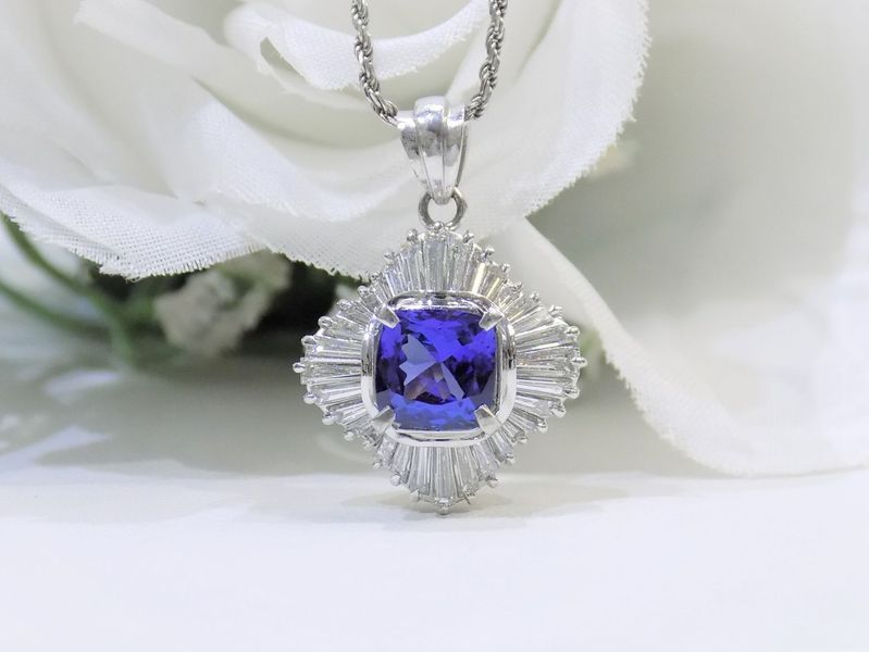 A dazzling blue gemstone pendant with diamond accents