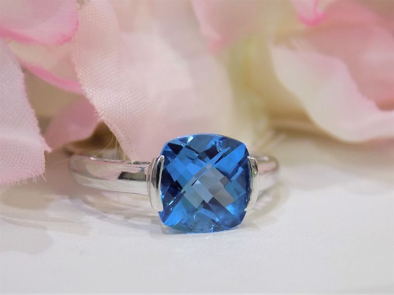 Blue gemstone ring with silver band