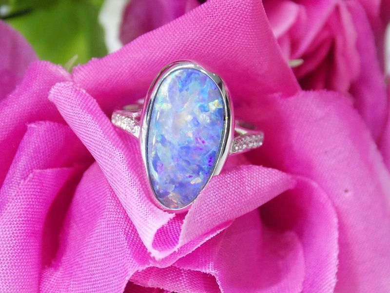 Silver ring with large blue and purple opal stone