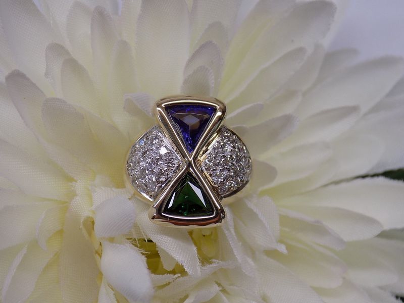 Gold ring with triangular blue and green gemstones