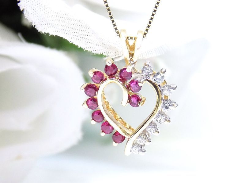 Gold heart pendant with ruby and diamond accents