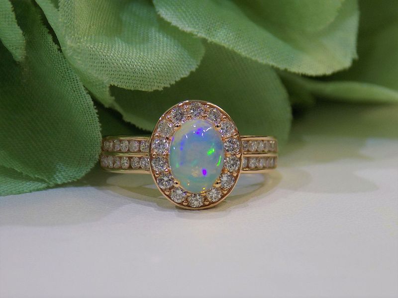 Gold ring with oval opal gemstone