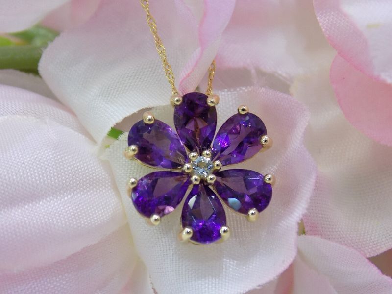 Gold flower pendant with purple amethyst petals