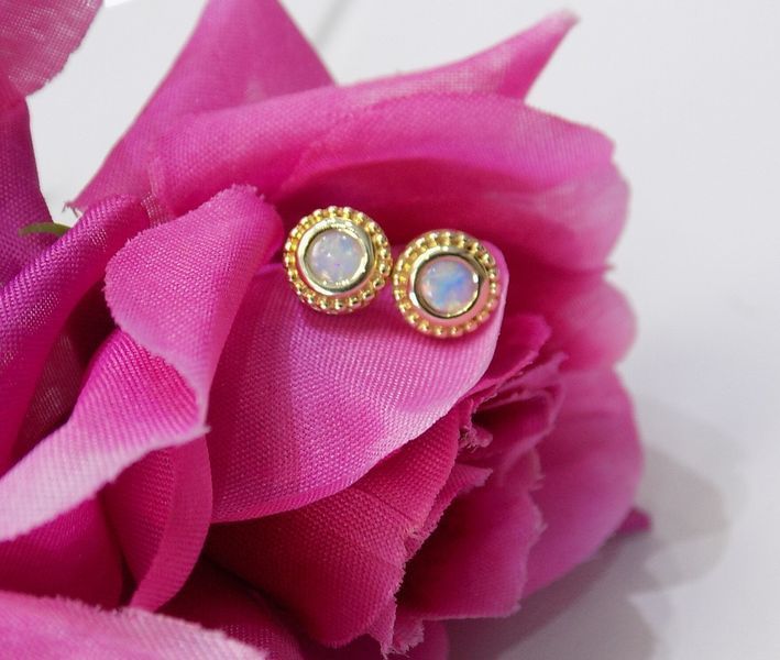Gold stud earrings with opals