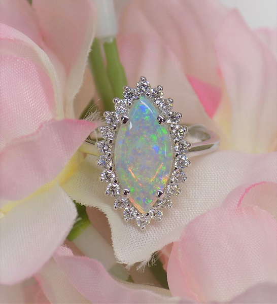 Ring with a marquise-cut opal gemstone