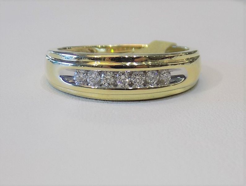 Gold band ring with inset diamonds