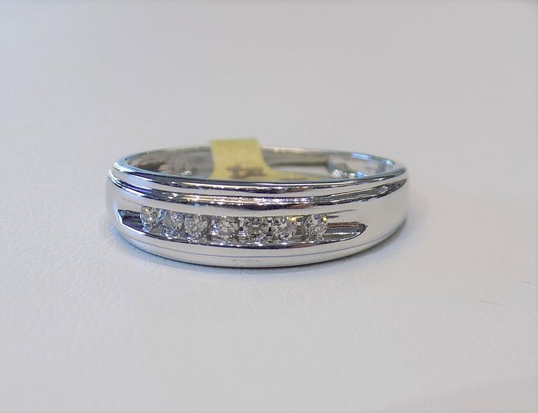 White gold ring with small diamonds set across the top
